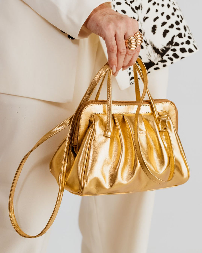 Bolsa feminina de couro transversal dourada metalizado Bianca